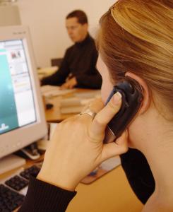 girl on phone listening to messages